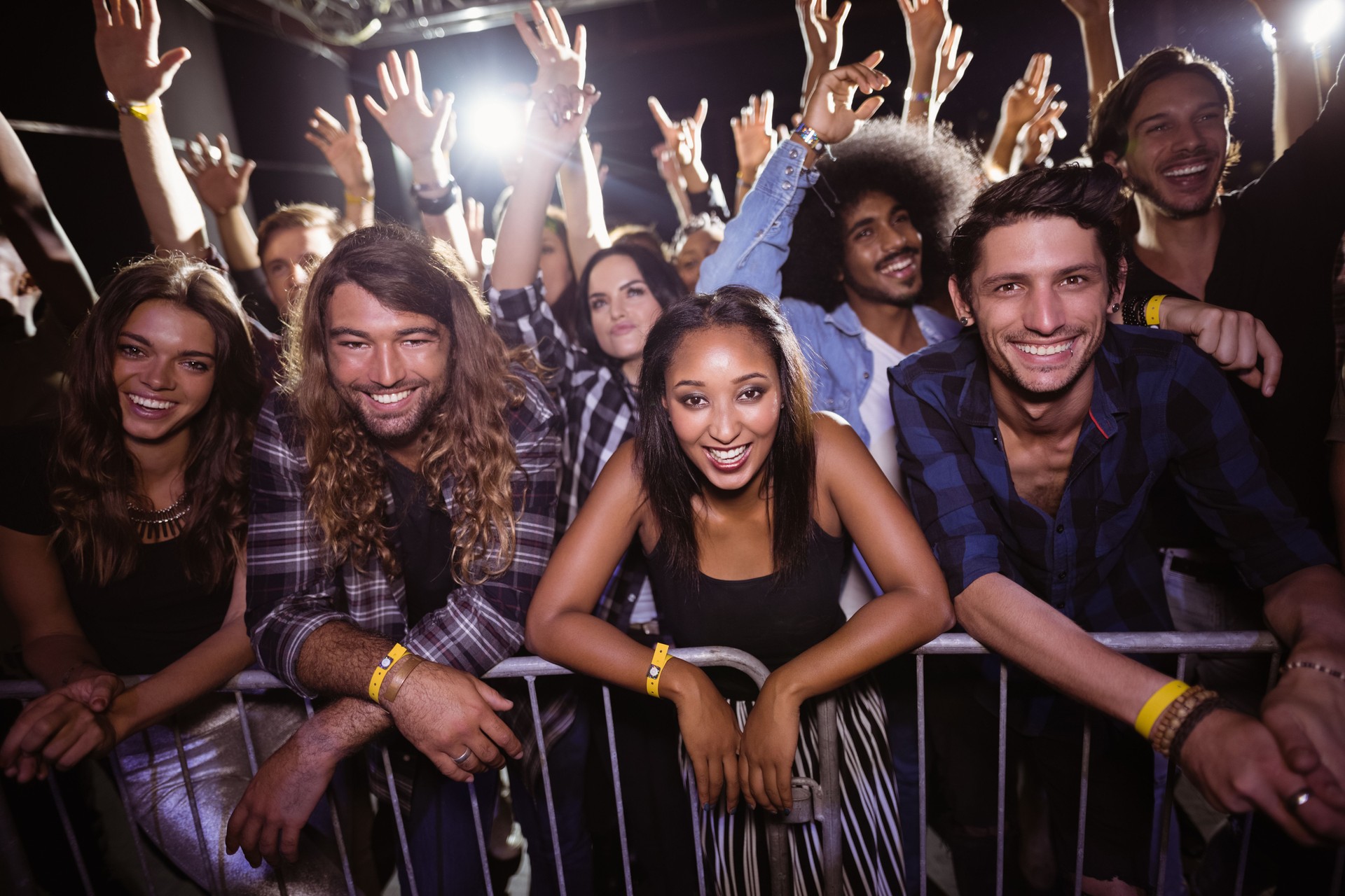 Portrait of friends enjoying at music festival